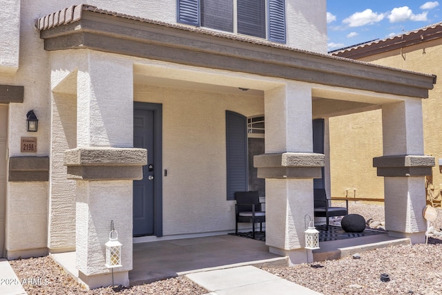 2198 W Pima Ave, Coolidge, AZ 85128 - view of exterior entry featuring a porch and stucco siding