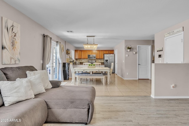 2198 W Pima Ave, Coolidge, AZ 85128 - living room with baseboards and light wood-style floors