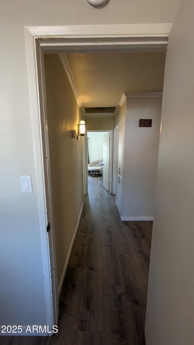 hall featuring crown molding, attic access, wood finished floors, and baseboards