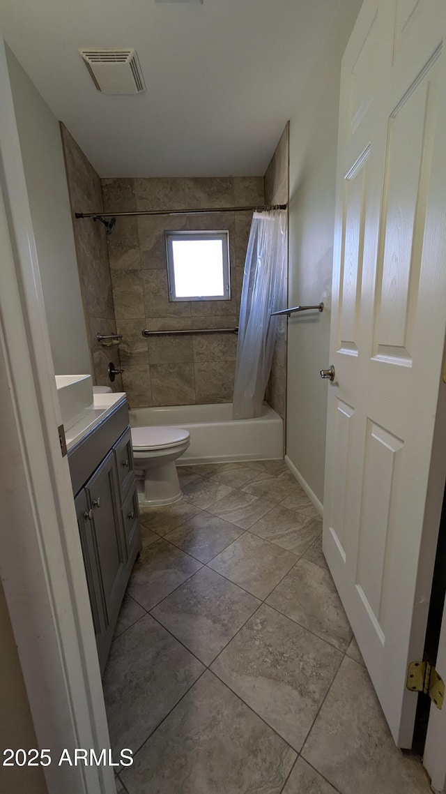 full bathroom with visible vents, vanity, shower / tub combo, and toilet