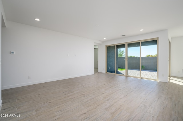 unfurnished room featuring light hardwood / wood-style floors