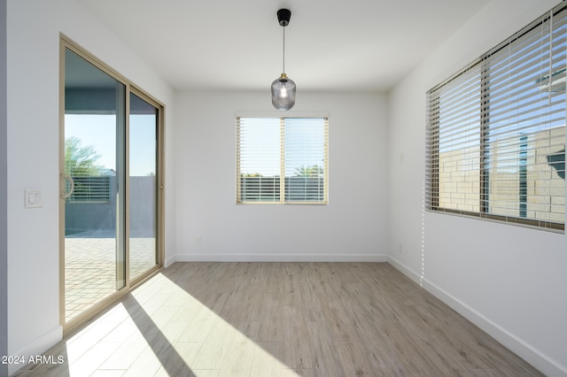 empty room with light hardwood / wood-style floors