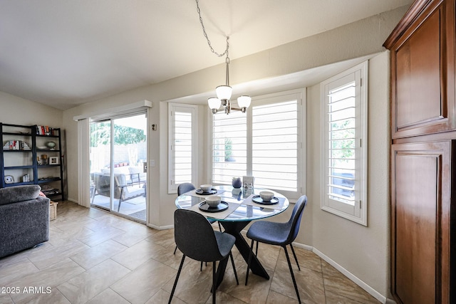 4558 E Libby St, Phoenix, AZ 85032 - dining space with a chandelier, lofted ceiling, and baseboards