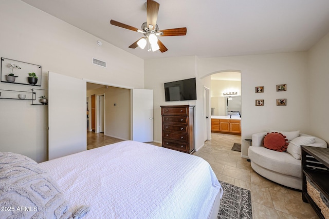 4558 E Libby St, Phoenix, AZ 85032 - bedroom featuring arched walkways, ceiling fan, connected bathroom, and high vaulted ceiling