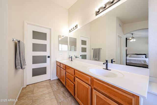 4558 E Libby St, Phoenix, AZ 85032 - ensuite bathroom featuring double vanity, a ceiling fan, and baseboards