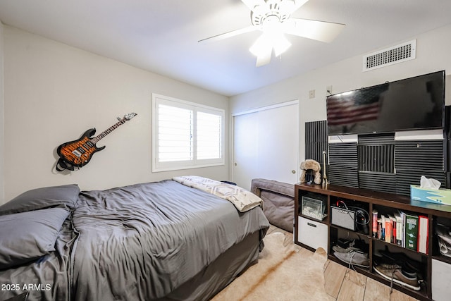 4558 E Libby St, Phoenix, AZ 85032 - bedroom with wood finished floors, a closet, and a ceiling fan
