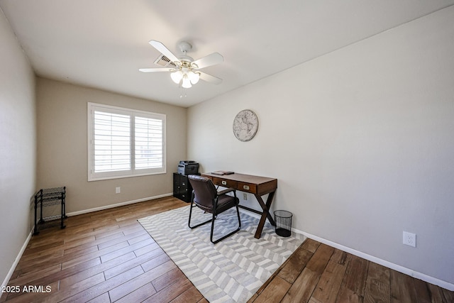 4558 E Libby St, Phoenix, AZ 85032 - office area featuring ceiling fan, wood finished floors, and baseboards