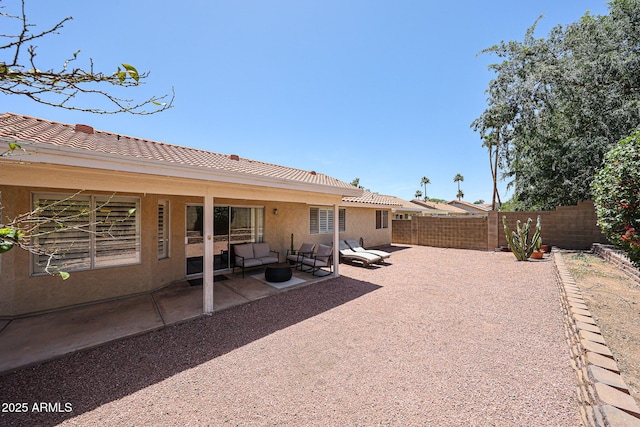 4558 E Libby St, Phoenix, AZ 85032 - rear view of property featuring stucco siding, a fenced backyard, a patio area, a tiled roof, and an outdoor hangout area