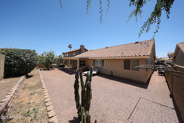4558 E Libby St, Phoenix, AZ 85032 - rear view of property with a fenced backyard, stucco siding, a tiled roof, and a patio