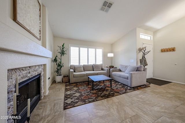 4558 E Libby St, Phoenix, AZ 85032 - living area with lofted ceiling, a fireplace, and baseboards