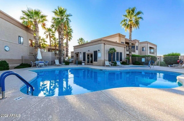 view of swimming pool featuring a patio area