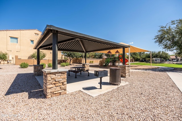 surrounding community featuring a gazebo, playground community, a patio, and fence