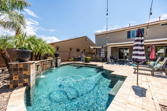 view of swimming pool featuring a fenced backyard, a fenced in pool, and a patio