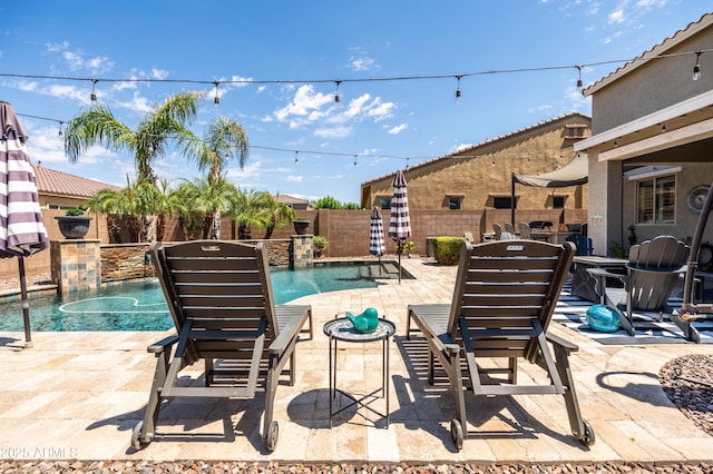 view of swimming pool featuring a fenced in pool, a patio, and a fenced backyard