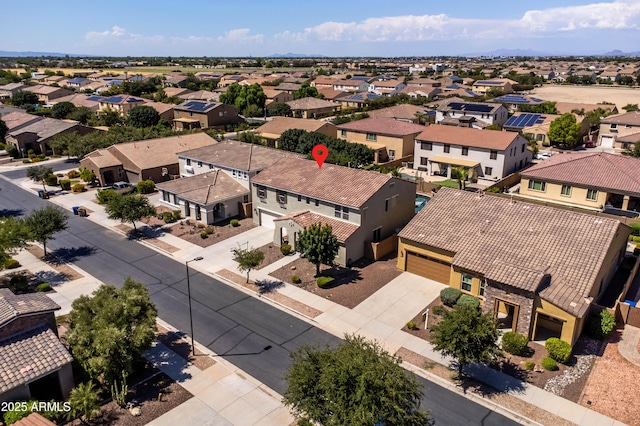 birds eye view of property with a residential view