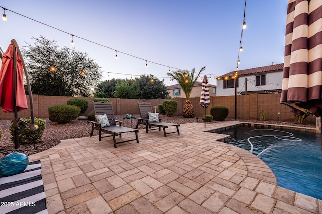 view of patio / terrace featuring a fenced backyard and a fenced in pool