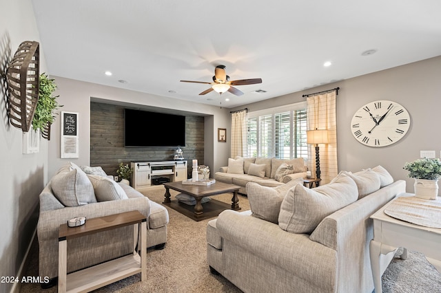 living area featuring visible vents, recessed lighting, an accent wall, and a ceiling fan