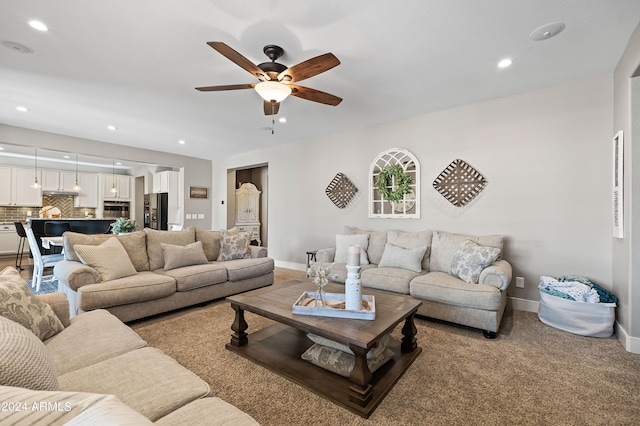 living room featuring recessed lighting, baseboards, and a ceiling fan