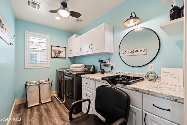 laundry room with visible vents, dark wood finished floors, washer and dryer, cabinet space, and a ceiling fan