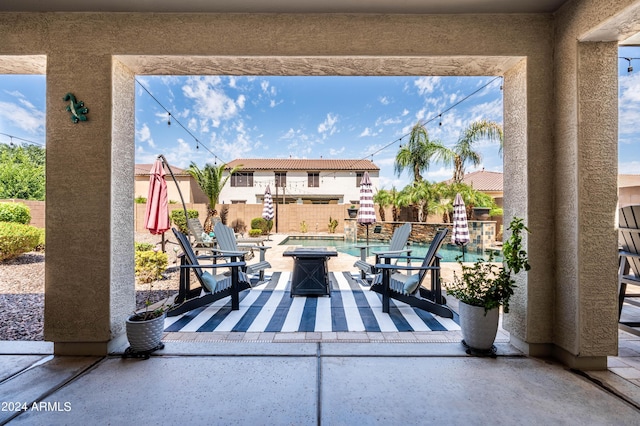 view of patio / terrace featuring a fire pit and a fenced backyard