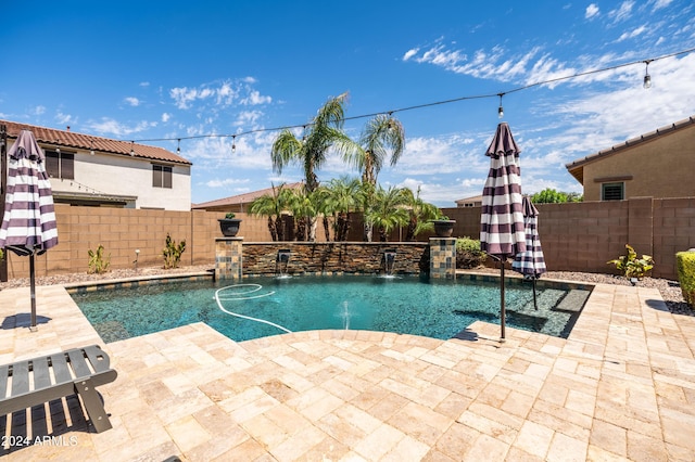 view of pool with a patio area, a fenced in pool, and a fenced backyard