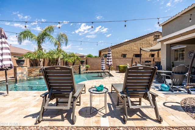 view of pool featuring a patio, a fenced backyard, and a fenced in pool