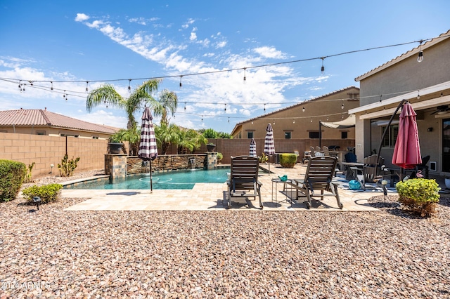 view of pool featuring a patio, a fenced backyard, and a fenced in pool