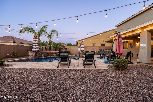 view of yard featuring a patio area, a fenced in pool, and a fenced backyard