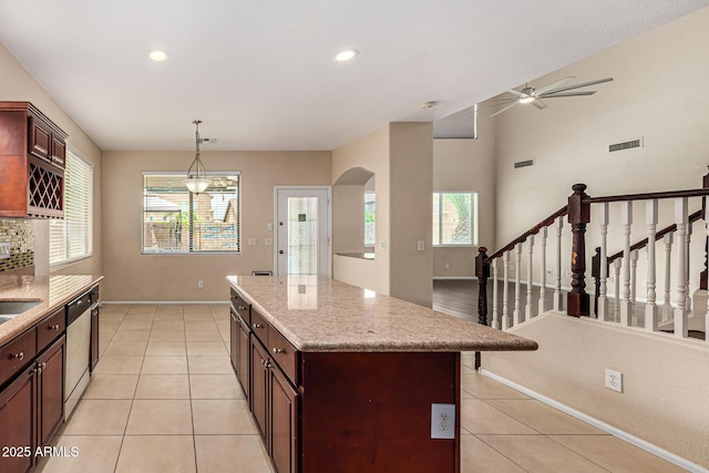 8214 S 48th Dr, Laveen, AZ 85339 - kitchen featuring stainless steel dishwasher, a ceiling fan, plenty of natural light, a center island, and recessed lighting
