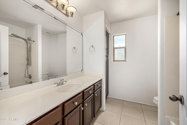 8214 S 48th Dr, Laveen, AZ 85339 - full bathroom with toilet, vanity, and tile patterned flooring