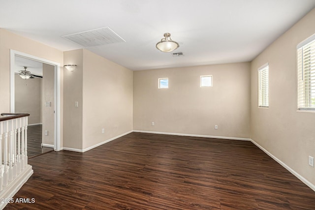 8214 S 48th Dr, Laveen, AZ 85339 - unfurnished room with dark wood finished floors and baseboards