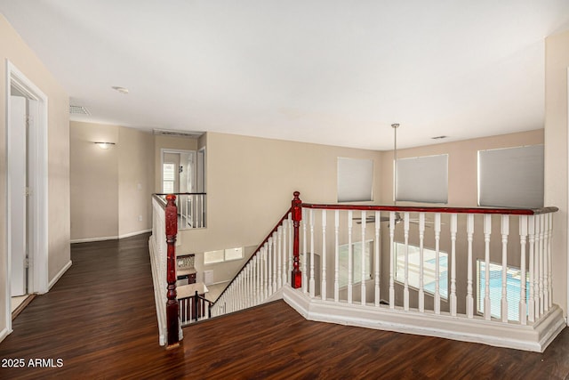 8214 S 48th Dr, Laveen, AZ 85339 - hall featuring an upstairs landing, wood finished floors, and baseboards
