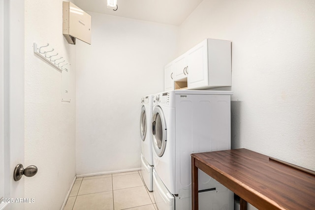 8214 S 48th Dr, Laveen, AZ 85339 - laundry room featuring independent washer and dryer, light tile patterned floors, cabinet space, and baseboards