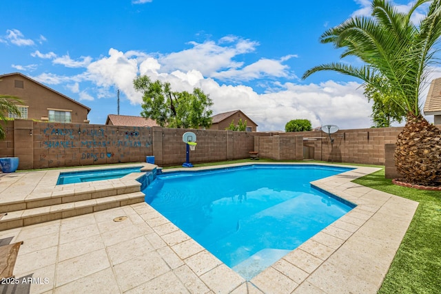 8214 S 48th Dr, Laveen, AZ 85339 - view of pool with a fenced backyard, a pool with connected hot tub, and a patio area