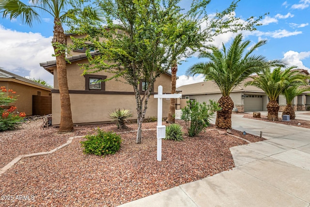 8214 S 48th Dr, Laveen, AZ 85339 - view of front of home with stucco siding and concrete driveway
