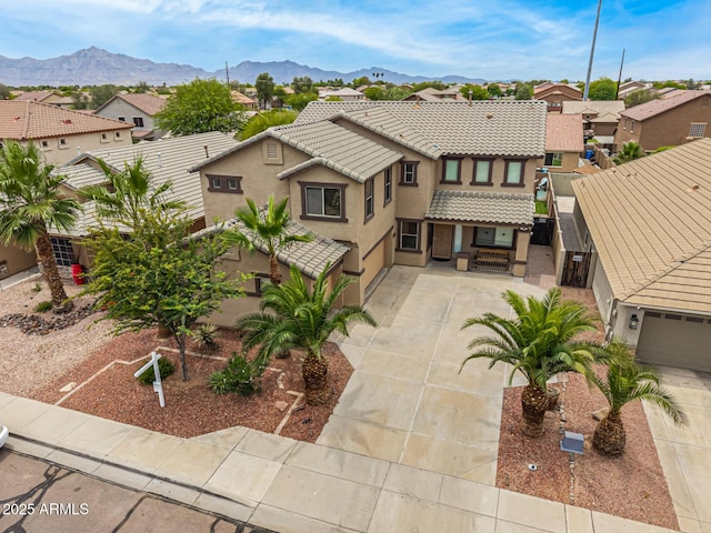 8214 S 48th Dr, Laveen, AZ 85339 - view of property featuring a residential view, stucco siding, driveway, and a tile roof
