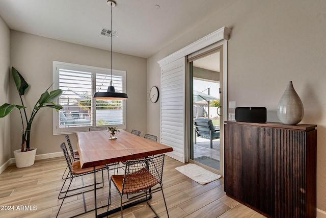 dining room with light hardwood / wood-style floors