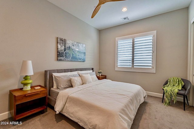 carpeted bedroom featuring ceiling fan