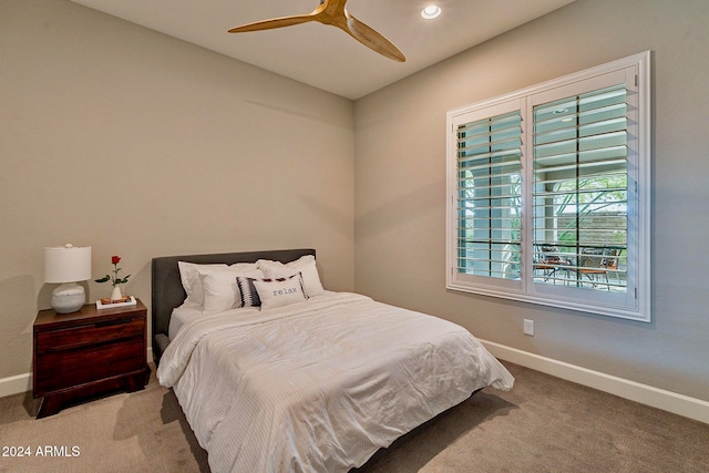 carpeted bedroom featuring ceiling fan