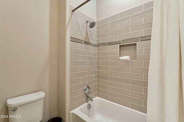 bathroom with shower / bath combo with shower curtain