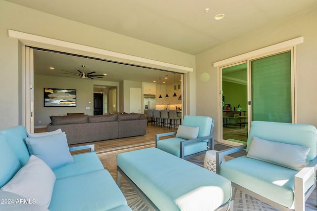 exterior space with ceiling fan and wood-type flooring