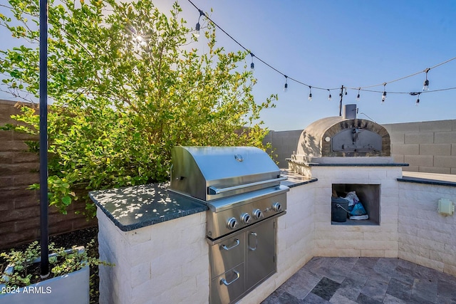 view of patio featuring area for grilling and an outdoor kitchen