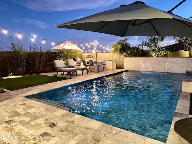 view of swimming pool featuring a patio area