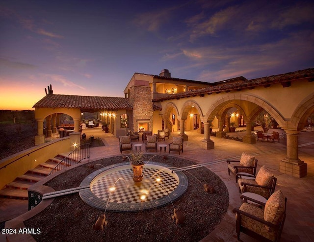 view of patio terrace at dusk