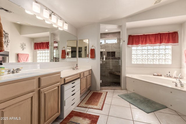 full bathroom with a garden tub, double vanity, visible vents, a shower stall, and tile patterned flooring