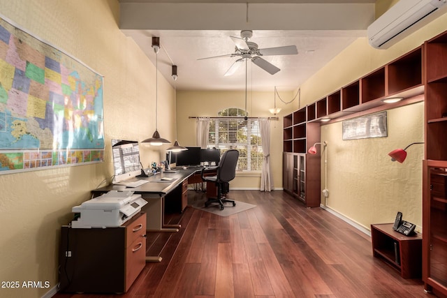 office area with a textured wall, dark wood-style flooring, a wall mounted air conditioner, and a ceiling fan