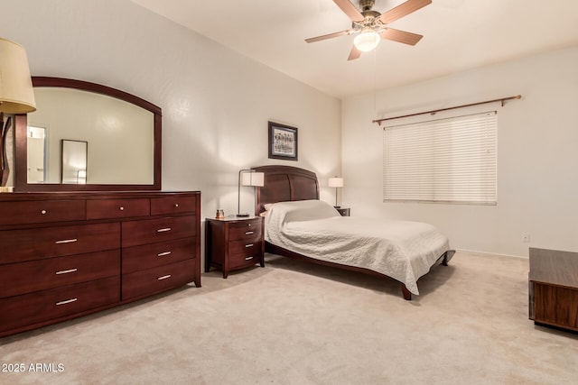 bedroom with light carpet and a ceiling fan