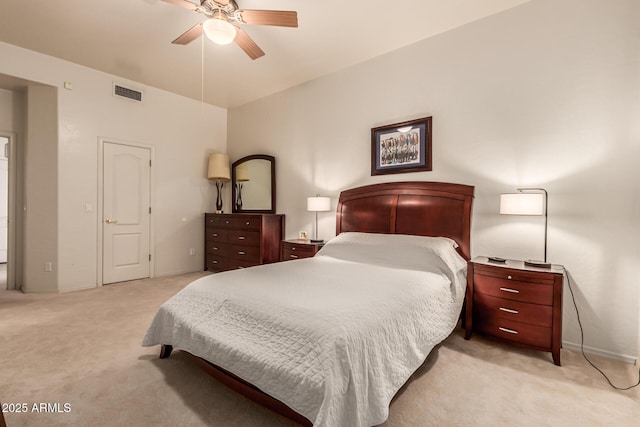 bedroom featuring a ceiling fan, light colored carpet, and visible vents