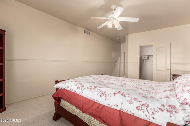 bedroom with ceiling fan, visible vents, and a closet