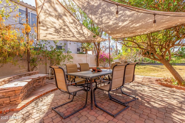 view of patio / terrace featuring fence and outdoor dining space